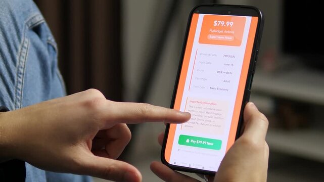 Reviewing a low-cost flight ticket on a smartphone. The screen displays a 79.99 dollars fare from BER to BCN with hand luggage included. Perfect for travel apps, budget airlines, and online booking
