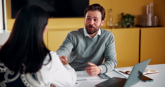 Laptop, handshake and business people in office with documents for finance deal or agreement. Paperwork, computer and financial manager shaking hands with investor for investment contract in meeting.