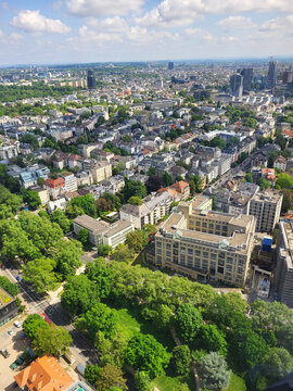 Elevated view across Frankfurts Westend district featuring residential neighborhoods, commercial buildings, green parks, and modern urban architecture. 