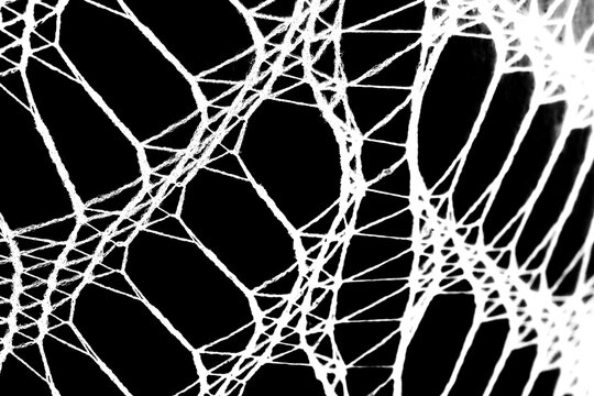 Abstract grunge black and white distressed transparent texture fabric fishnet netting overlay background	