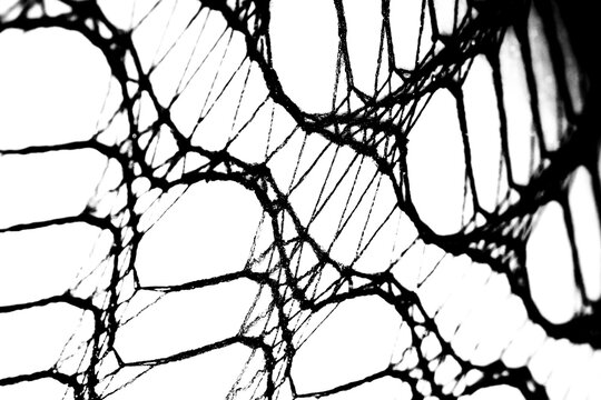 Abstract grunge black and white distressed transparent texture fabric fishnet netting overlay background	