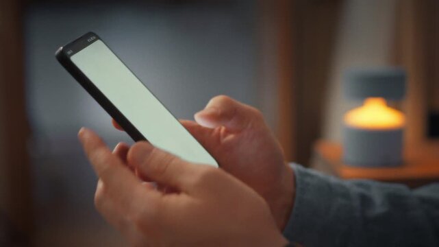 In contemporary office lounge, man confidently taps unfamiliar number on his smartphone's touch keyboard and places call. The decisive gesture underscores instant mobile communication in daily life