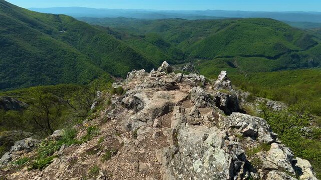 Green slopes roll endlessly beneath a clear. Ovcar Kablar Gorge. Balkans, Serbia
