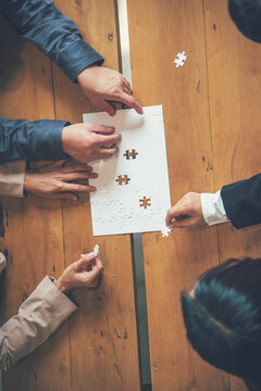 Vertical Stakeholders business trust teams hands holding jigsaw puzzle synergy. Vertical Horizon Implement puzzle improve solve synergy organize team building connection plan trust service strategy