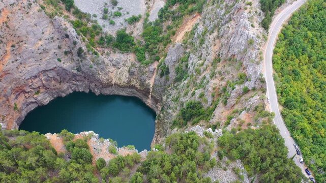 Red lake in a sinkhole in Croatia