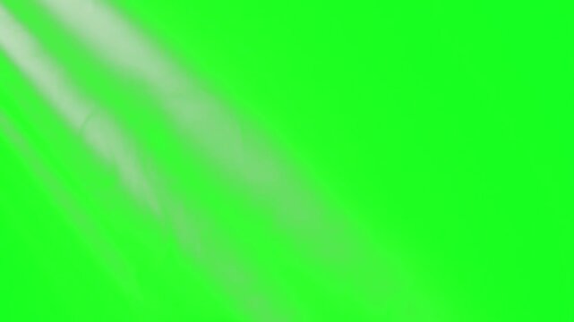Top left corner sunburst and radiant glare project across a green screen chroma key background. This high-quality visual effect asset is designed for premium cinematic video