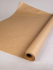 A roll of kraft paper on a gray background © Beliakina Ekaterina