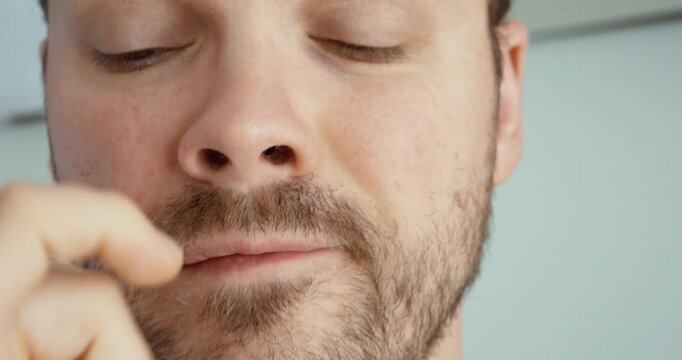 Man Picking Nose Close Up Habit and Personal Hygiene Concept