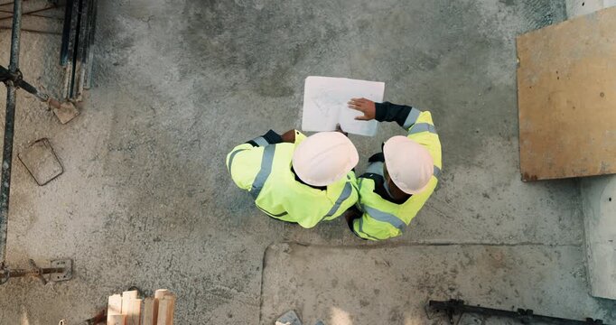 Construction, talking and above of men with blueprint for planning, building project and renovation. Civil engineering, teamwork and people with paperwork for floorplan, design and infrastructure