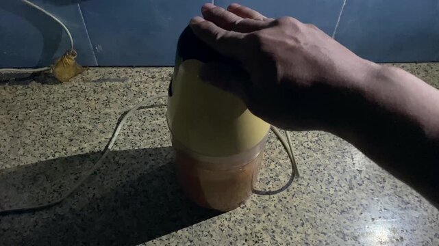 POV shot of crushing fresh red chilies to make homemade chillie paste. Footage clip capturing the authentic process of making homemade Indonesian sambal chili paste.