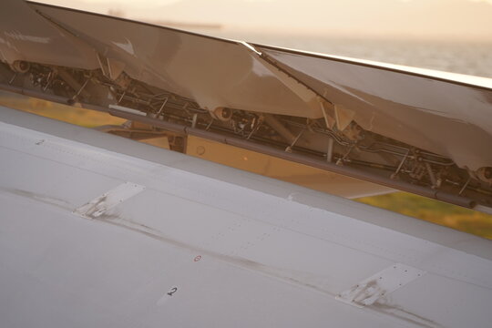 Close Up Airplane Wing Spoilers And Flap Mechanisms