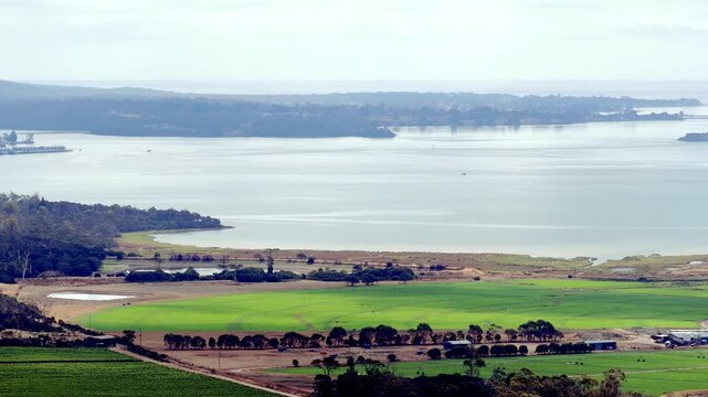 Seaside tele aerial panorama of Tamar Valley and river in Tasmania agriculture region.