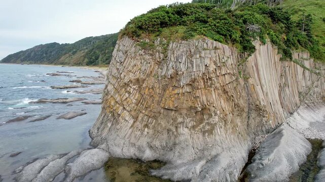 Hexagon Basalt Columns. Drone Captures Layered Geological Structures And Erosion On Shoreline
