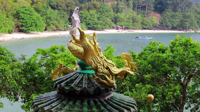 Statue of Guanyin godess or Kwan Yin is the revered East Asian Bodhisattva of mercy, compassion, and unconditional love at Pangkor island in Malaysia