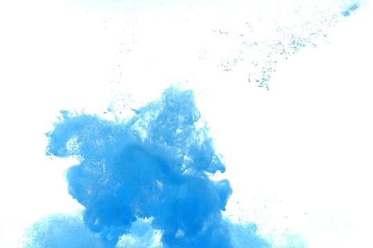 Blue color dye melt on white background,Abstract smoke pattern,Colored liquid dye,Splash paint