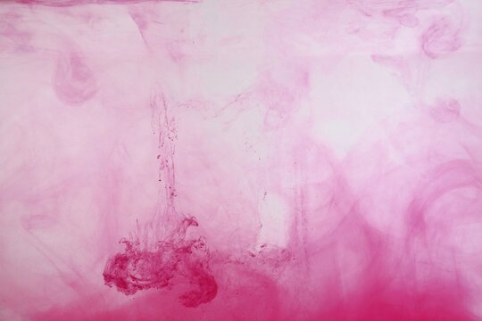 Red color dye melt on white background,Abstract smoke pattern,Colored liquid dye,Splash paint