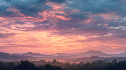 Fototapeta premium Vibrant Sunset Over Rolling Hills and Dense Forest with Colorful Sky