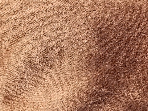 Soft brown suede texture close-up for design backgrounds  
