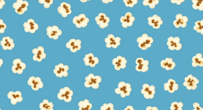 Fun and vibrant seamless pattern of fluffy popcorn pieces scattered randomly across a bright blue decorative background.