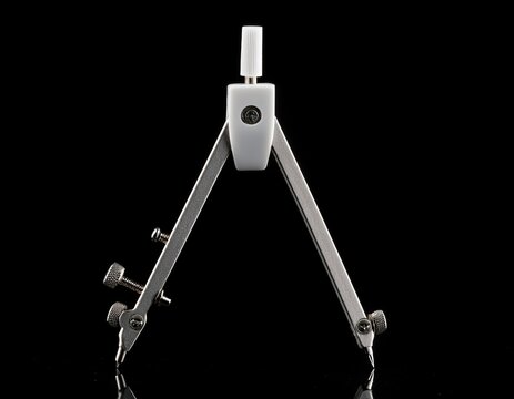 a white compass on a black background for drawing and drafting purposes