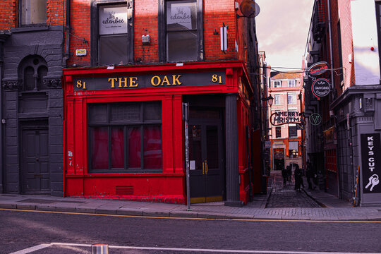 The historic red facade of The Oak pub in Dublin city, Ireland