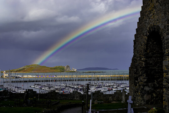 Vibrant rainbow over Howth Harbour and Ireland's Eye island in Dublin