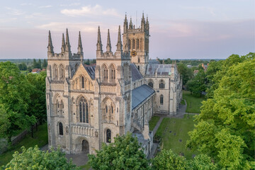 Selby Abbey in Selby, North Yorkshire, England, aerial view of the historic abbey, town centre rooftops, streets and medieval architecture. © Chris Chambers