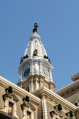 Obraz premium Close-up architectural details of Philadelphia City Hall including the clock tower, ornate stonework, and historic design in downtown Philadelphia.