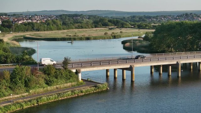 Slow Drone Shot Towards Bridge and Nature Reserve