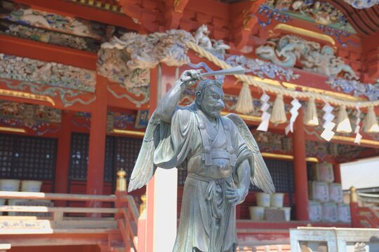 Majestic Tengu statue at vermilion Yakuo-in Temple, Mount Takao.