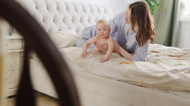 Mother and baby share moments of fun at home in the morning