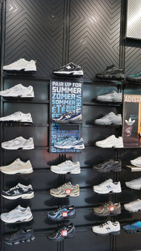 Palermo, Italy - May 8, 2026: Aw Lab store at Palermo, Italy with various models of sports sneakers from popular brands Adidas, New Balance, Asics, On Running