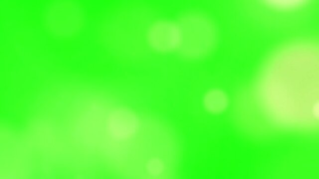 Bokeh light circles glow softly against a vibrant green background that provides significant copy space for various creative digital design projects requiring a clean and modern visual aesthetic.