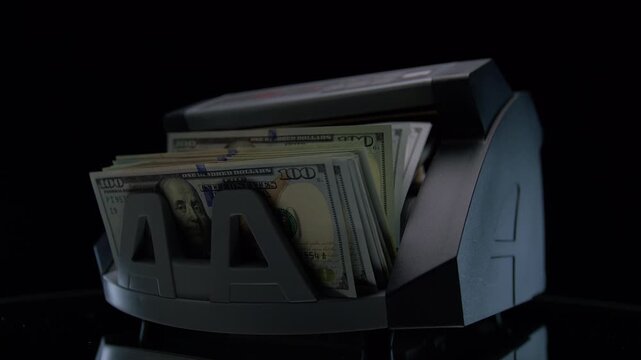 Money Counter Processing US Dollar Bills
