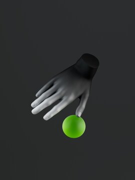 A black hand gently touches a green sphere against a dark background.