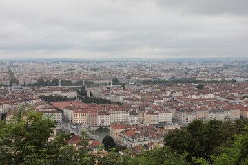 Fototapeta premium Panoramic aerial view of Lyon cityscape in France under cloudy sky