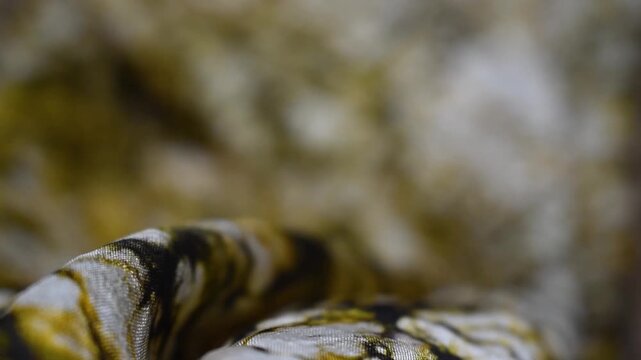 Hand printed wax crack batik silk fabric texture with artisanal dye patterns