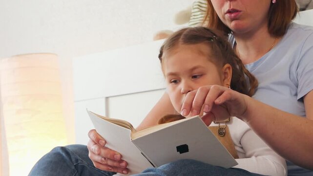 Storytime with caregiver and child. Calm space for language learning and emotional support in early education. Close up