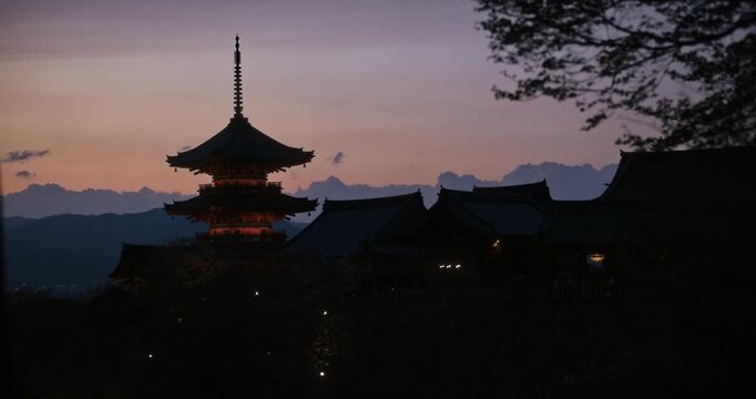 Epic, cinematic silhouette of kiyomizu-dera Japanese temple at dusk