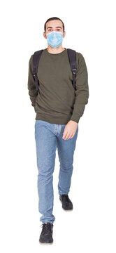 Full length portrait of cautious man traveler walks with a face mask covering his nose as protection against different viruses. Casual guy prevention measure isolated on transparent background