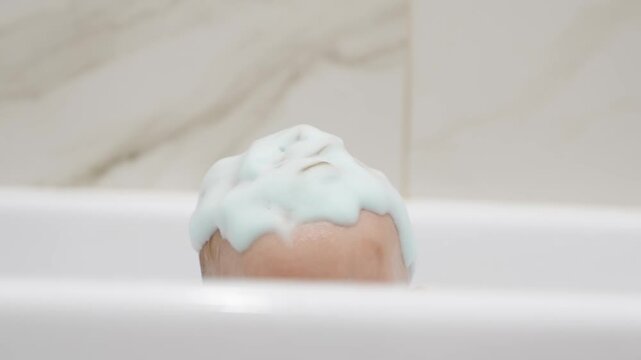 Bath time fun with baby in a tub