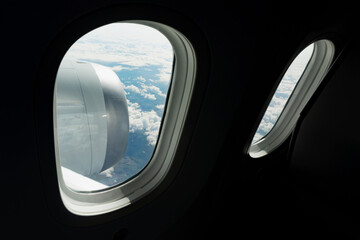Fototapeta premium Cloudy view through the aircraft window