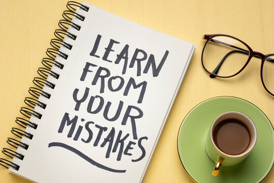 Learn from your mistakes reminder - handwriting in a sketchbook with a cup of coffee, learning, determination and perseverance concept