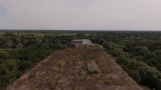 Aerial flyover of the vast concrete roof of Bunker Valentin Bremen