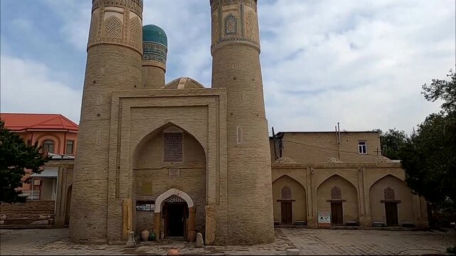 Medium shot of historic Chor Minor madrasah with blue domes in Bukhara