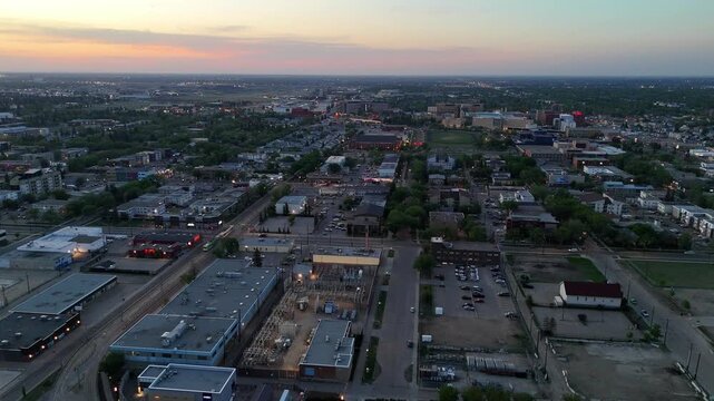 Aerial view of downtown Edmonton skyline with modern buildings all at sunset. 