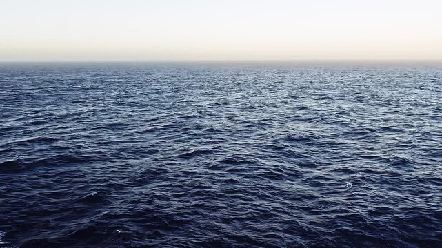 Sailing through endless shades of blue. Stunning ocean view from a cruise ship. Nothing but deep blue waters and open skies