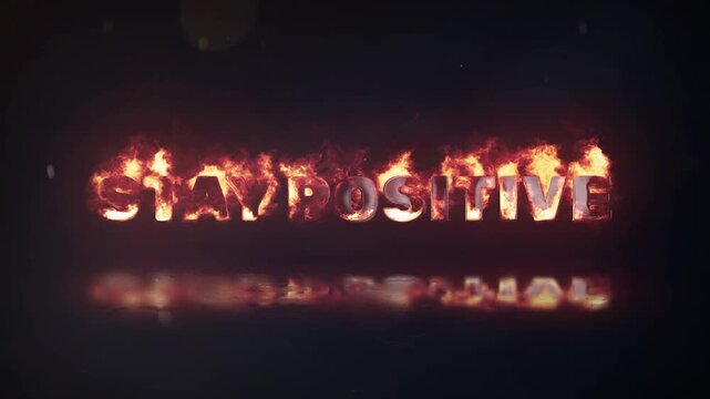 Stay positive typography title text intro engulfed in fiery flames with reflection motivational burning concept