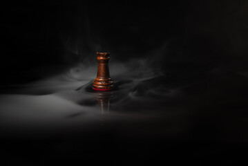 Single chess rook surrounded by smoke on a dark background, symbolizing strategy, leadership, decision‑making, power, stability, planning and high‑level strategic thinking. © Artur