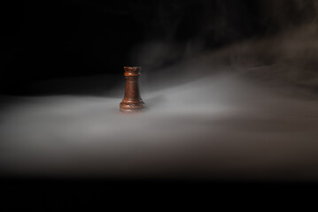 Single chess rook surrounded by smoke on a dark background, symbolizing strategy, leadership, decision‑making, power, stability, planning and high‑level strategic thinking. © Artur